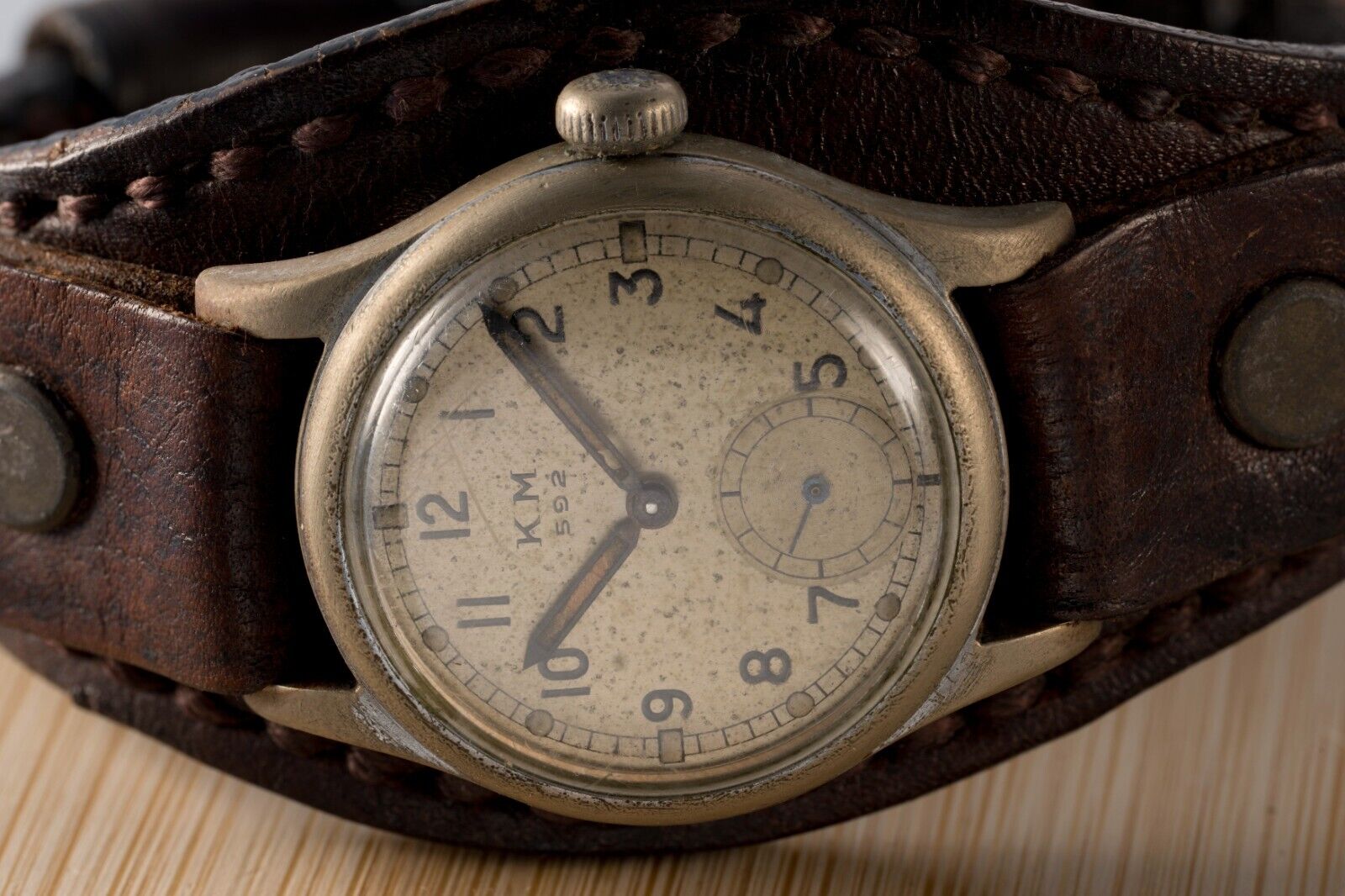 Detailed view of KM Alpina 592 watch face, vintage military features, unique craftsmanship