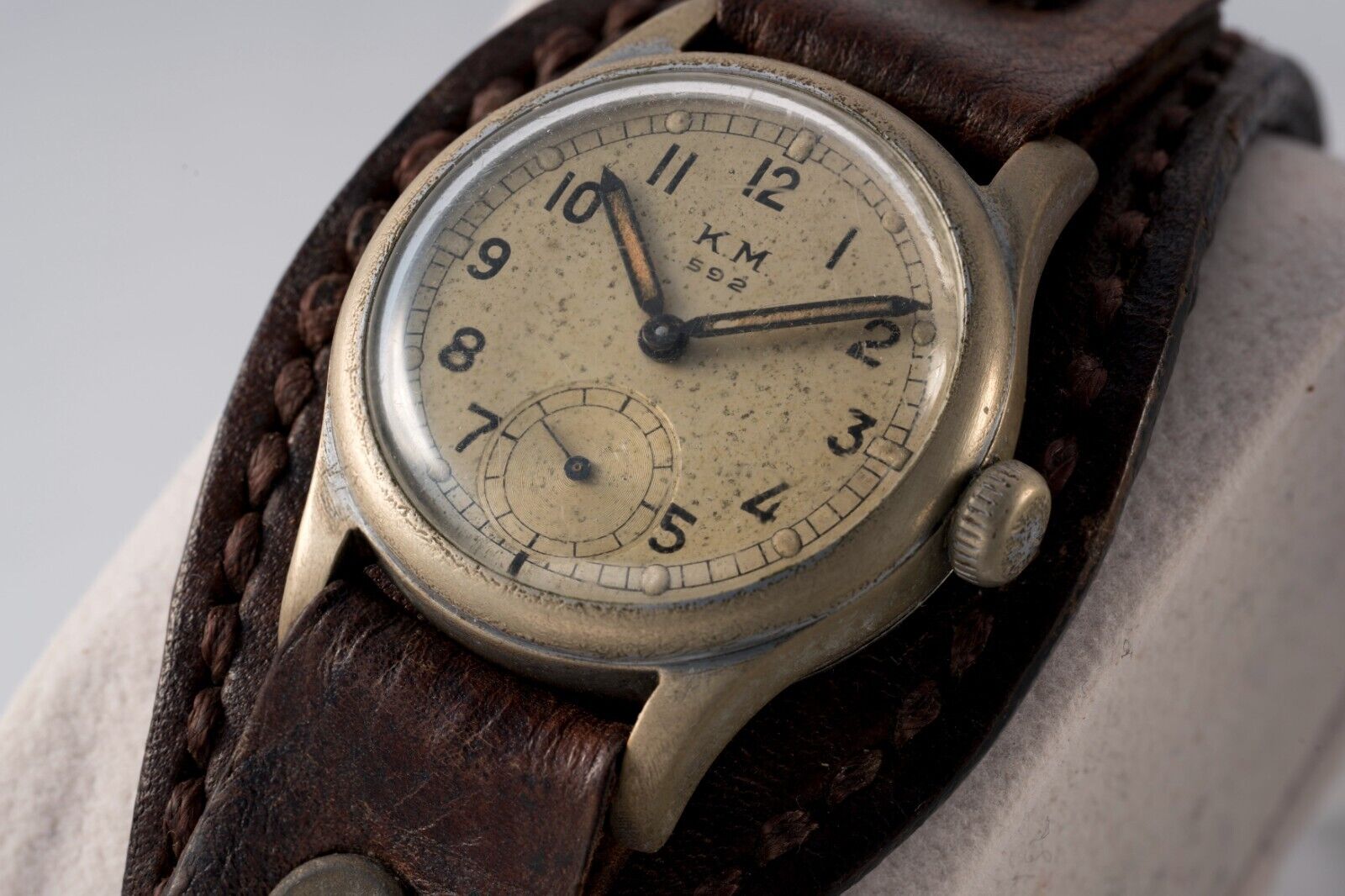 Close-up of KM Alpina 592 vintage wristwatch, WWII military design, classic craftsmanship