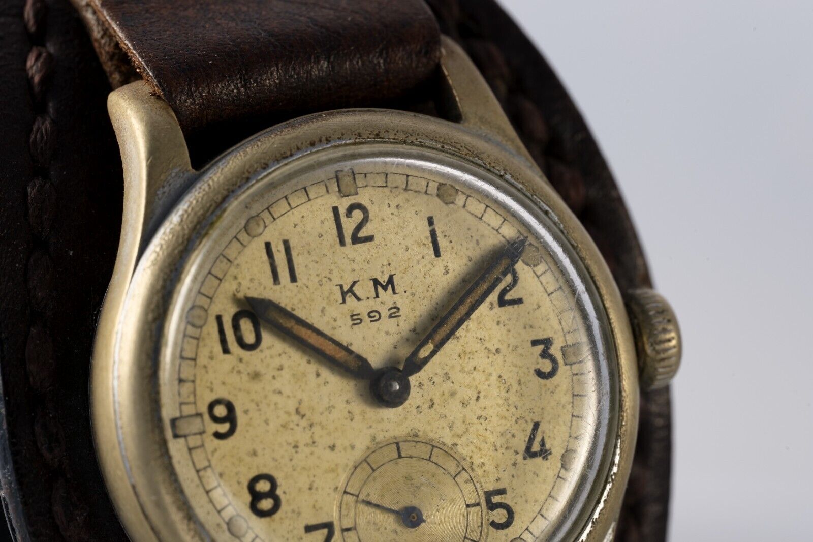 Side profile of KM Alpina 592 Kriegsmarine watch, vintage military style, historical significance